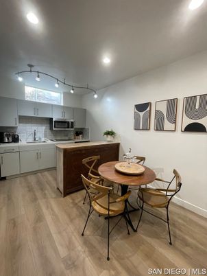 Dining room, Interior, Kitchen, Recessed Lighting, Stainless Steel Appliances, Wood Texture Flooring