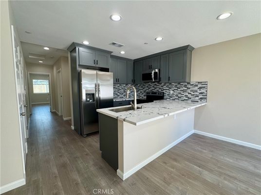 Interior, Kitchen, Recessed Lighting, Stainless Steel Appliances, Wood Texture Flooring