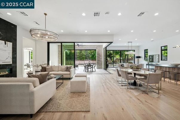 Chandelier, Dining room, Fireplace, Interior, Living room, Pendant Lights, Recessed Lighting, Wood Texture Flooring