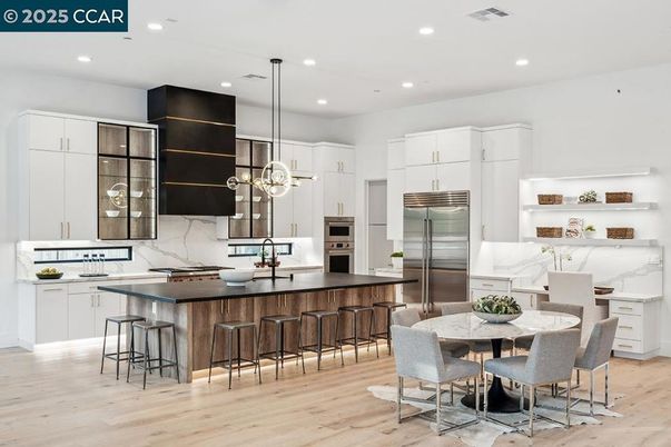 Dining room, Interior, Kitchen, Marble Walls, Pendant Lights, Recessed Lighting, Stainless Steel Appliances, Wood Texture Flooring