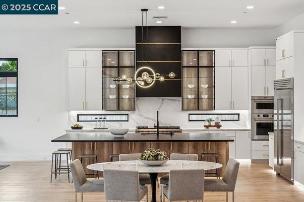 Dining room, Interior, Kitchen, Pendant Lights, Recessed Lighting, Stainless Steel Appliances, Wood Texture Flooring