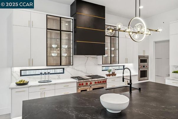 Interior, Kitchen, Marble Walls, Pendant Lights, Recessed Lighting, Stainless Steel Appliances