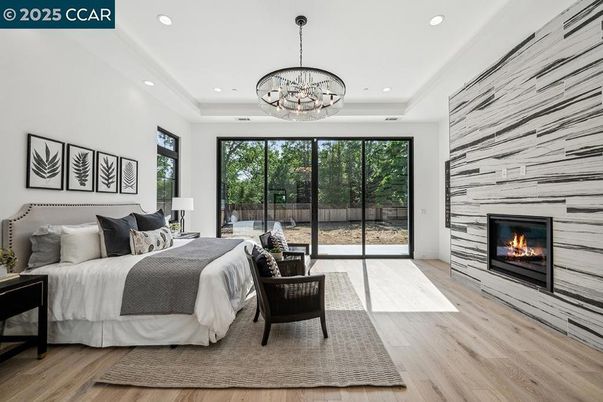 Bedroom, Chandelier, Fireplace, Interior, Recessed Lighting, Wood Texture Flooring