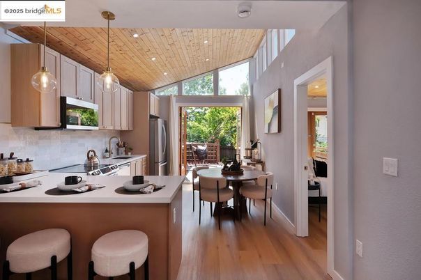 Dining room, Interior, Kitchen, Pendant Lights, Recessed Lighting, Stainless Steel Appliances, Wooden Ceilings, Wood Texture Flooring