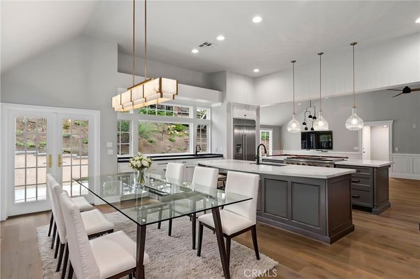 Chandelier, Dining room, Interior, Kitchen, Pendant Lights, Recessed Lighting, Stainless Steel Appliances, Wood Texture Flooring