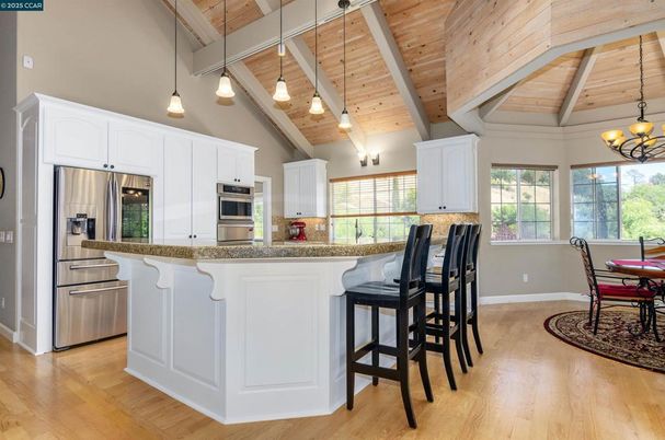Chandelier, Dining room, Interior, Kitchen, Pendant Lights, Stainless Steel Appliances, Wooden Beams, Wooden Ceilings, Wood Texture Flooring