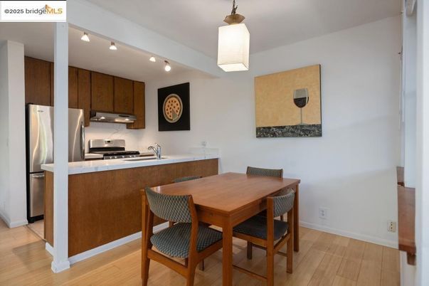 Dining room, Interior, Kitchen, Pendant Lights, Stainless Steel Appliances, Wood Texture Flooring