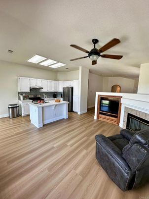 Fireplace, Interior, Kitchen, Stainless Steel Appliances, Wood Texture Flooring