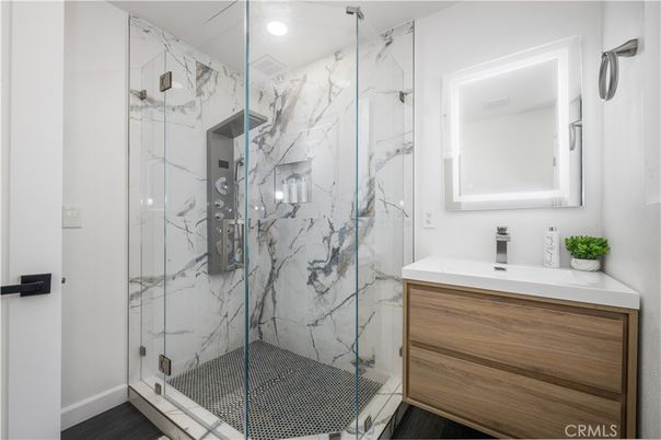 Bathroom, Glass Shower, Interior, Marble Walls, Recessed Lighting, Wood Texture Flooring