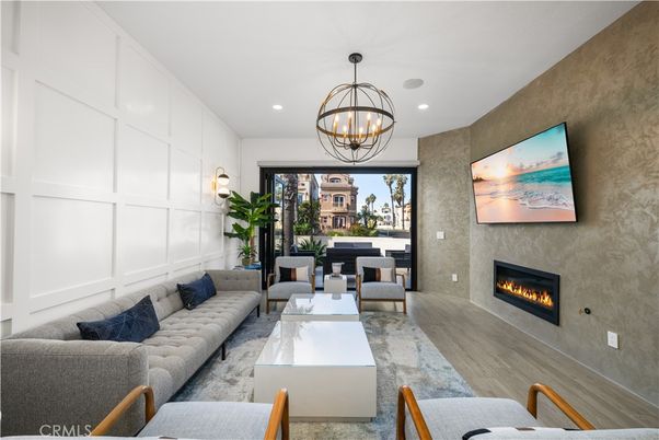 Chandelier, Fireplace, Interior, Living room, Recessed Lighting, Wood Texture Flooring
