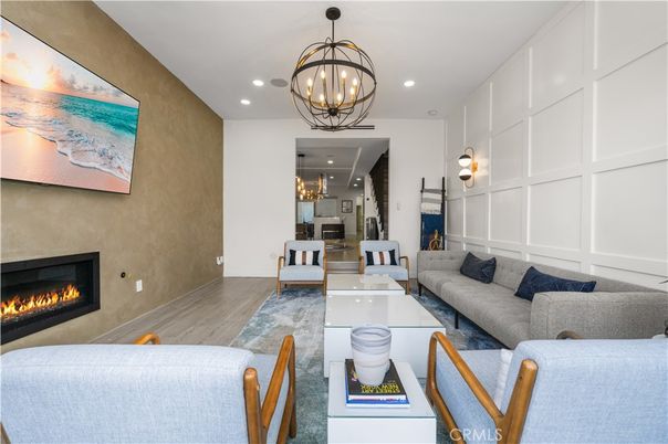 Chandelier, Dining room, Fireplace, Interior, Living room, Recessed Lighting, Wood Texture Flooring