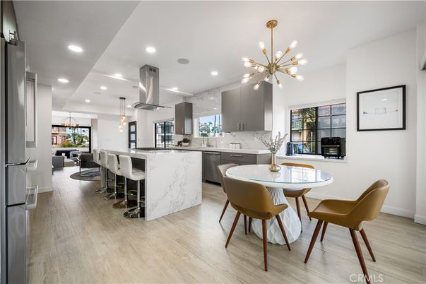 Dining room, Interior, Kitchen, Marble Walls, Pendant Lights, Recessed Lighting, Stainless Steel Appliances, Wood Texture Flooring