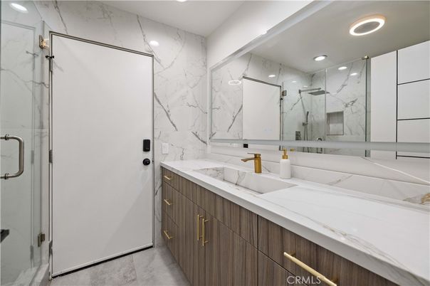 Bathroom, Dual Sink Vanities, Glass Shower, Interior, Marble Walls, Recessed Lighting