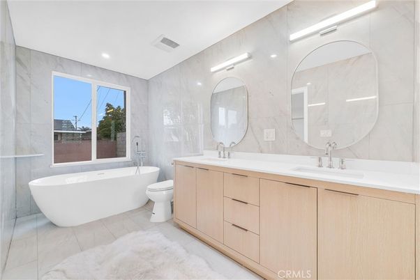 Bathroom, Dual Sink Vanities, Free Standing Baths, Interior, Marble, Marble Walls, Recessed Lighting