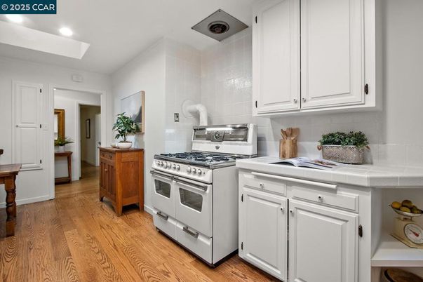 Interior, Kitchen, Recessed Lighting, Tile Countertops, Wood Texture Flooring