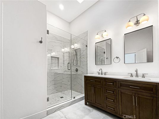 Bathroom, Dual Sink Vanities, Glass Shower, Interior, Marble Walls, Recessed Lighting