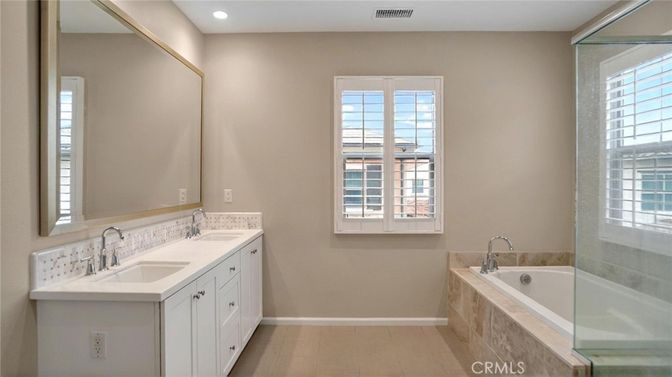 Bathroom, Dual Sink Vanities, Glass Shower, Interior, Recessed Lighting, Wood Texture Flooring