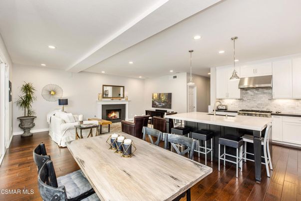 Dining room, Fireplace, Interior, Kitchen, Living room, Pendant Lights, Recessed Lighting, Stainless Steel Appliances, Wood Texture Flooring