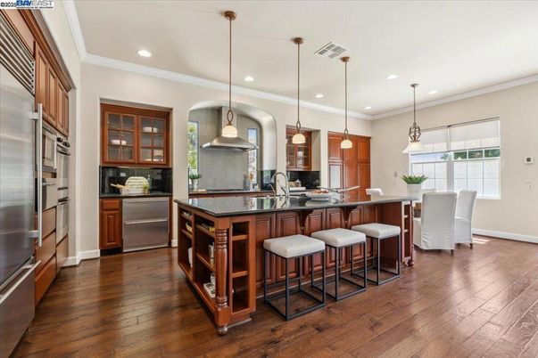 Dining room, Interior, Kitchen, Pendant Lights, Recessed Lighting, Stainless Steel Appliances, Wood Texture Flooring
