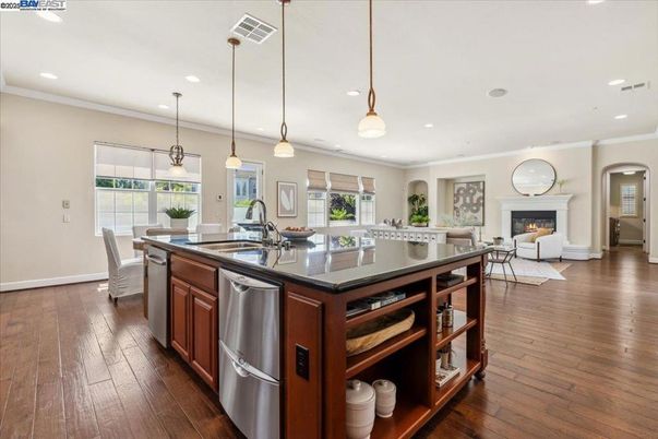 Dining room, Fireplace, Interior, Kitchen, Living room, Pendant Lights, Recessed Lighting, Stainless Steel Appliances, Wood Texture Flooring