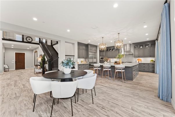 Chandelier, Dining room, Interior, Kitchen, Pendant Lights, Recessed Lighting, Stainless Steel Appliances, Wood Texture Flooring