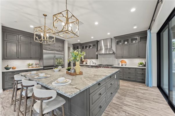 Chandelier, Interior, Kitchen, Pendant Lights, Recessed Lighting, Stainless Steel Appliances, Wood Texture Flooring