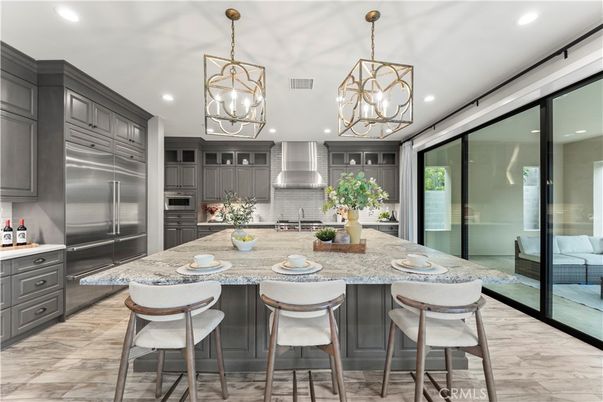 Chandelier, Interior, Kitchen, Pendant Lights, Recessed Lighting, Stainless Steel Appliances, Wood Texture Flooring