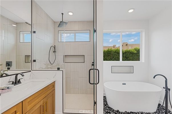 Bathroom, Dual Sink Vanities, Free Standing Baths, Glass Shower, Interior, Marble Walls, Recessed Lighting