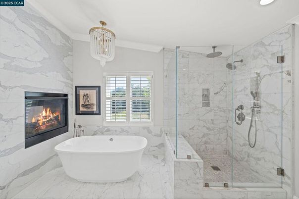 Bathroom, Fireplace, Free Standing Baths, Glass Shower, Interior, Marble, Marble Walls, Recessed Lighting