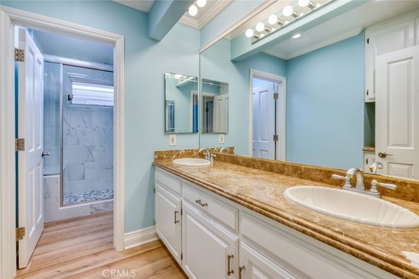 Bathroom, Dual Sink Vanities, Interior, Marble Walls, Wood Texture Flooring