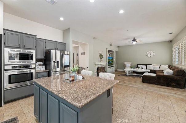 Fireplace, Interior, Kitchen, Living room, Recessed Lighting, Stainless Steel Appliances, Wood Texture Flooring
