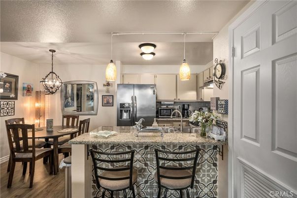 Chandelier, Dining room, Interior, Kitchen, Pendant Lights, Stainless Steel Appliances, Wood Texture Flooring