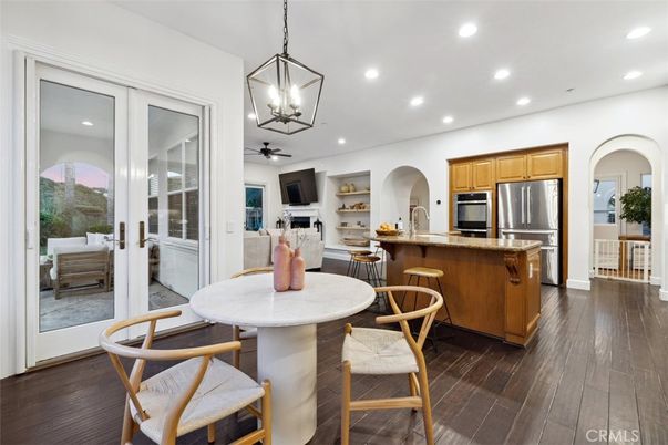 Dining room, Interior, Kitchen, Pendant Lights, Recessed Lighting, Stainless Steel Appliances, Wood Texture Flooring