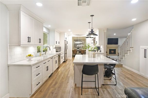 Fireplace, Interior, Kitchen, Pendant Lights, Recessed Lighting, Stainless Steel Appliances, Wood Texture Flooring