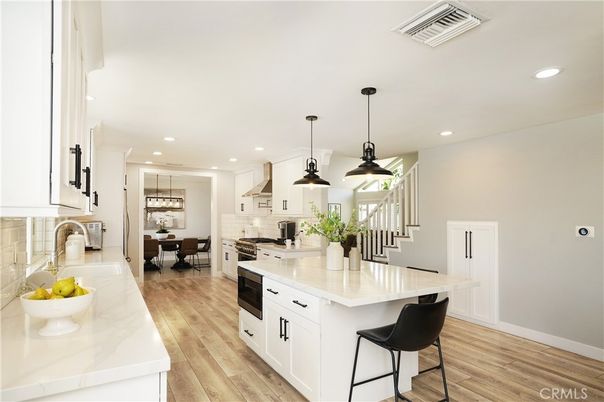 Dining room, Interior, Kitchen, Pendant Lights, Recessed Lighting, Stainless Steel Appliances, Wood Texture Flooring