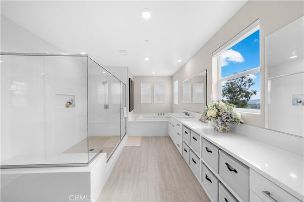 Bathroom, Dual Sink Vanities, Glass Shower, Interior, Recessed Lighting, Wood Texture Flooring