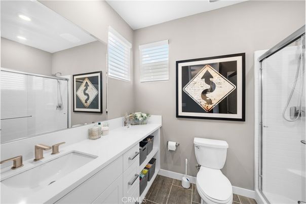 Bathroom, Dual Sink Vanities, Glass Shower, Interior, Recessed Lighting, Wood Texture Flooring