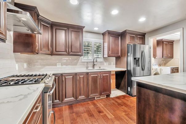 Interior, Kitchen, Recessed Lighting, Stainless Steel Appliances, Washer, Wood Texture Flooring