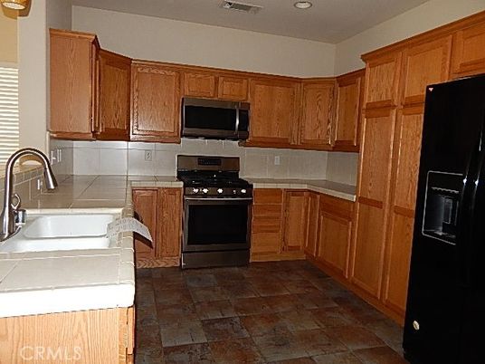 Interior, Kitchen, Recessed Lighting, Stainless Steel Appliances, Tile Countertops