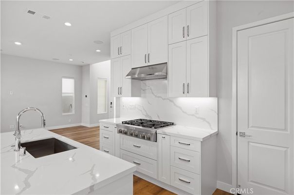 Interior, Kitchen, Marble Walls, Recessed Lighting, Stainless Steel Appliances, Wood Texture Flooring