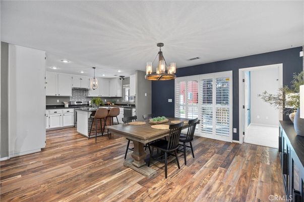 Chandelier, Dining room, Interior, Kitchen, Pendant Lights, Recessed Lighting, Stainless Steel Appliances, Wood Texture Flooring