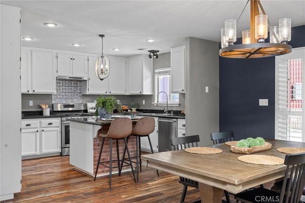 Dining room, Interior, Kitchen, Pendant Lights, Recessed Lighting, Stainless Steel Appliances, Wood Texture Flooring