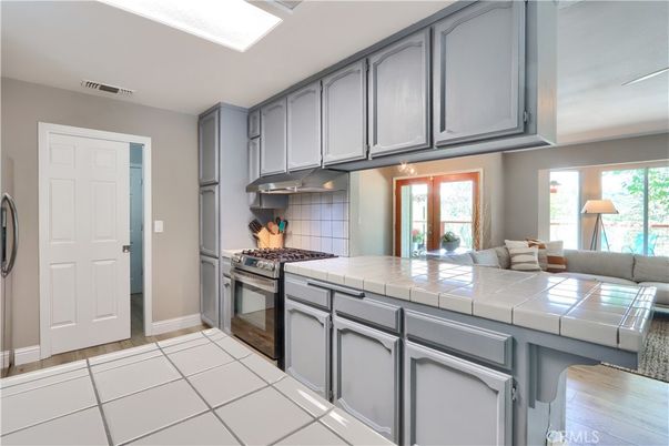Interior, Kitchen, Tile Countertops, Wood Texture Flooring