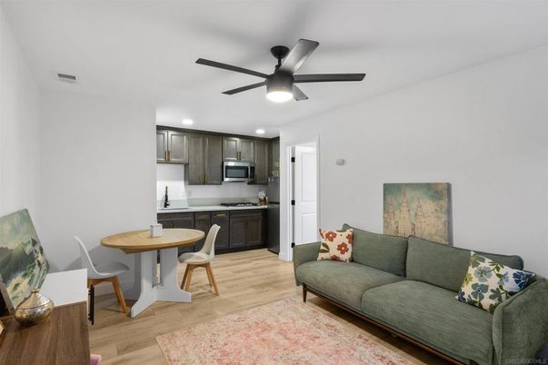Dining room, Interior, Kitchen, Living room, Recessed Lighting, Stainless Steel Appliances, Wood Texture Flooring