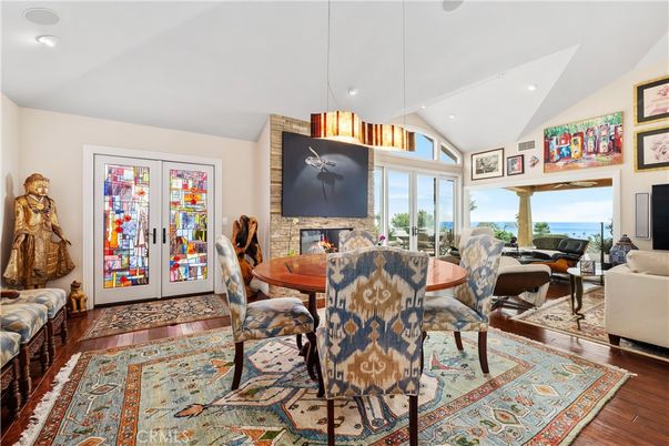 Dining room, Fireplace, Interior, Pendant Lights, Recessed Lighting, Water, Wood Texture Flooring