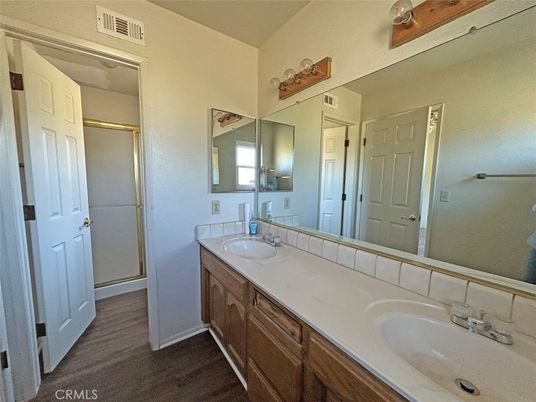 Bathroom, Dual Sink Vanities, Glass Shower, Interior, Wood Texture Flooring