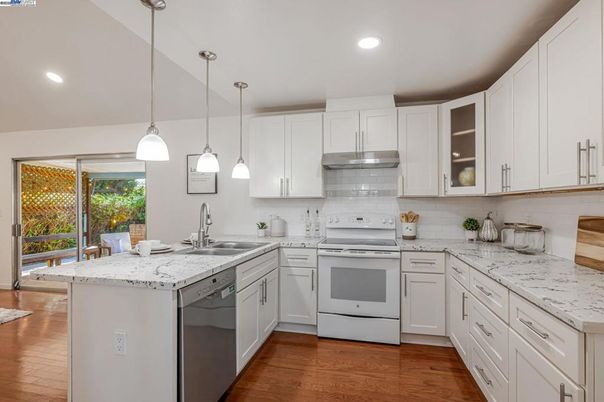 Interior, Kitchen, Pendant Lights, Recessed Lighting, Stainless Steel Appliances, Wood Texture Flooring