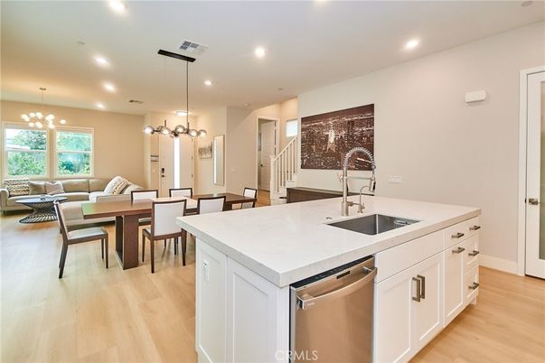 Dining room, Interior, Kitchen, Living room, Pendant Lights, Recessed Lighting, Stainless Steel Appliances, Wood Texture Flooring