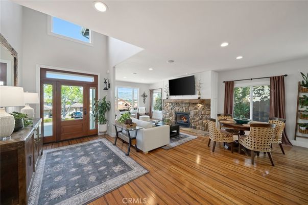 Dining room, Fireplace, Interior, Living room, Recessed Lighting, Wood Texture Flooring