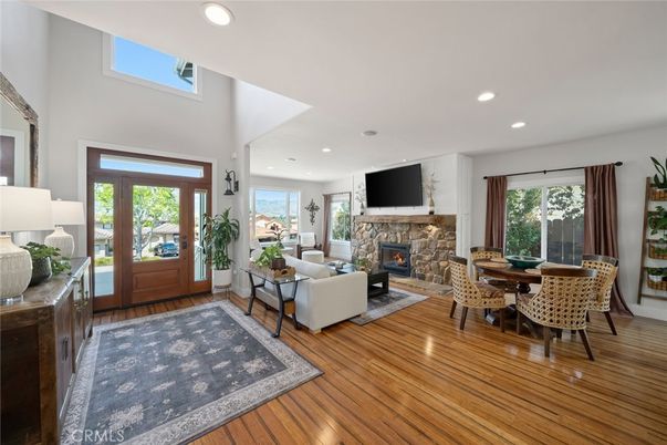 Dining room, Fireplace, Interior, Living room, Recessed Lighting, Wood Texture Flooring